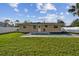 Home features a private pool and fenced backyard at 831 Searcy Ave, Sarasota, FL 34237