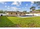 Private pool and fenced backyard with palm tree at 831 Searcy Ave, Sarasota, FL 34237