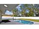 Private, refreshing pool with a large backyard and lush landscaping at 831 Searcy Ave, Sarasota, FL 34237