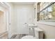 Clean bathroom with white vanity and toilet at 831 Searcy Ave, Sarasota, FL 34237