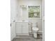 Modern bathroom with white vanity, toilet and shower at 831 Searcy Ave, Sarasota, FL 34237