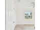 Bedroom with wood-look floors, window, and a large closet at 831 Searcy Ave, Sarasota, FL 34237