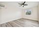 Bright bedroom with ceiling fan and window at 831 Searcy Ave, Sarasota, FL 34237