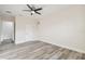 Bright bedroom with wood-look floors and ceiling fan at 831 Searcy Ave, Sarasota, FL 34237