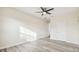 Spacious bedroom featuring wood-look floors and natural light at 831 Searcy Ave, Sarasota, FL 34237