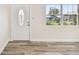 Front entry with glass door and hardwood floors at 831 Searcy Ave, Sarasota, FL 34237