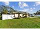 House exterior showcasing a well-maintained lawn at 831 Searcy Ave, Sarasota, FL 34237