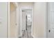 Hallway with wood-look floors and access to kitchen at 831 Searcy Ave, Sarasota, FL 34237