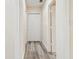Bright hallway with wood-look flooring at 831 Searcy Ave, Sarasota, FL 34237