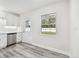 Modern kitchen with white cabinets and stainless steel appliances at 831 Searcy Ave, Sarasota, FL 34237