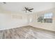 Spacious living room with wood-look floors and ceiling fan at 831 Searcy Ave, Sarasota, FL 34237
