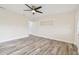 Living room with built-in shelving and ceiling fan at 831 Searcy Ave, Sarasota, FL 34237