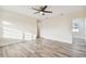 Spacious living area with hardwood floors and ceiling fan at 831 Searcy Ave, Sarasota, FL 34237