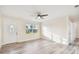 Bright and airy living room with hardwood floors and ceiling fan at 831 Searcy Ave, Sarasota, FL 34237