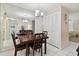 Bright dining area with built-in storage and mirrored wall at 2700 Bayshore Blvd # 3308, Dunedin, FL 34698