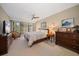 Spacious main bedroom with a king-size bed, large windows and ample dresser space at 50 Coe Rd # 311, Belleair, FL 33756