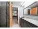 Bathroom with marble shower, vanity, and view into bedroom at 50 Coe Rd # 311, Belleair, FL 33756