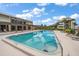 Community swimming pool with lounge chairs at 50 Coe Rd # 311, Belleair, FL 33756