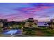 Evening view of community pool and waterfront at 50 Coe Rd # 311, Belleair, FL 33756