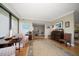 Spacious living room with hardwood floors, large windows, and ample natural light at 50 Coe Rd # 311, Belleair, FL 33756