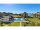 Community pool with lush landscaping at 50 Coe Rd # 311, Belleair, FL 33756