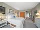 Bright bedroom with a queen-size bed and access to exterior at 50 Coe Rd # 311, Belleair, FL 33756