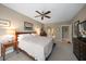 Bright and airy main bedroom with a king-size bed and plenty of natural light at 50 Coe Rd # 311, Belleair, FL 33756
