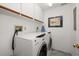 Convenient laundry room with washer and dryer at 50 Coe Rd # 311, Belleair, FL 33756