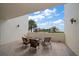Spacious balcony with wicker furniture, offering scenic water views at 50 Coe Rd # 311, Belleair, FL 33756