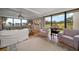 Bright living room with hardwood floors and water views at 50 Coe Rd # 311, Belleair, FL 33756