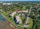 Aerial view of condo building near golf course at 50 Coe Rd # 311, Belleair, FL 33756