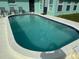 Inviting kidney-shaped swimming pool in the backyard at 6483 25Th N St, St Petersburg, FL 33702