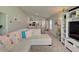 Open living room showcasing seamless flow between living, kitchen, and dining areas at 13043 Pennybrook Dr, Riverview, FL 33579