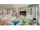 Living room boasts a large TV, comfortable seating, and built-in shelving at 13043 Pennybrook Dr, Riverview, FL 33579