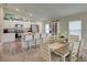 Modern kitchen with white cabinets, granite countertops, and stainless steel appliances at 13043 Pennybrook Dr, Riverview, FL 33579