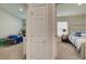 Hallway with view of two bedrooms and a linen closet at 13043 Pennybrook Dr, Riverview, FL 33579