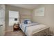 Bedroom with a queen bed, nightstand and double doors to closet at 13043 Pennybrook Dr, Riverview, FL 33579