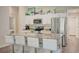 Modern kitchen with white cabinets, granite countertops, and stainless steel appliances at 13043 Pennybrook Dr, Riverview, FL 33579