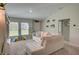 Living area with sectional sofa and view into kitchen and dining area at 13043 Pennybrook Dr, Riverview, FL 33579