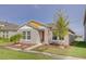 Cute one-story home with a red door and yellow trim at 13043 Pennybrook Dr, Riverview, FL 33579