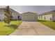 Single-car garage with driveway, offering convenient parking at 13043 Pennybrook Dr, Riverview, FL 33579