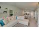 Spacious living room with a sectional sofa and access to kitchen and dining areas at 13043 Pennybrook Dr, Riverview, FL 33579