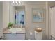 Bathroom with granite countertop, single sink and toilet at 13043 Pennybrook Dr, Riverview, FL 33579