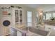 Modern kitchen with white cabinets, granite countertops, and stainless steel appliances at 13043 Pennybrook Dr, Riverview, FL 33579