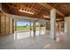 Spacious unfinished basement garage with high ceilings and multiple garage doors at 1227 Osowaw Blvd, Spring Hill, FL 34607