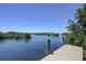 Wooden dock extending over calm water with mangrove views at 1227 Osowaw Blvd, Spring Hill, FL 34607
