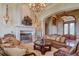 Bright living room with a fireplace, large windows, and comfortable seating at 1227 Osowaw Blvd, Spring Hill, FL 34607