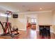 Well-equipped home gym featuring exercise machines and a hardwood floor at 1227 Osowaw Blvd, Spring Hill, FL 34607