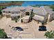Luxury waterfront home with circular driveway and helicopter at 1227 Osowaw Blvd, Spring Hill, FL 34607
