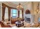 Spacious living room features a fireplace, large windows with water views, and comfortable seating at 1227 Osowaw Blvd, Spring Hill, FL 34607